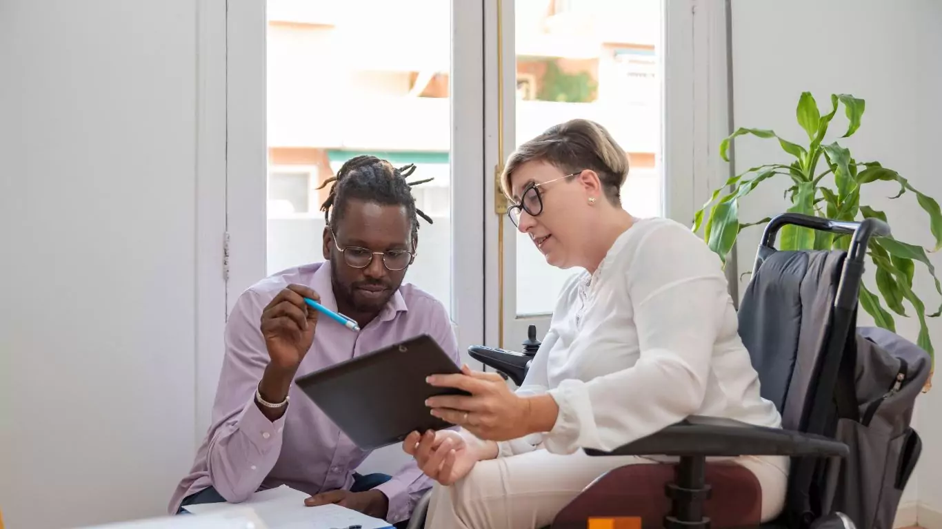 An image of a man meeting with a person with disability
