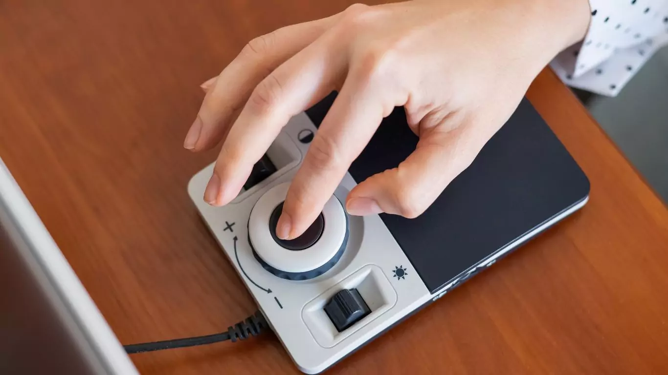 A woman uses a special magnification device for the visually impaired