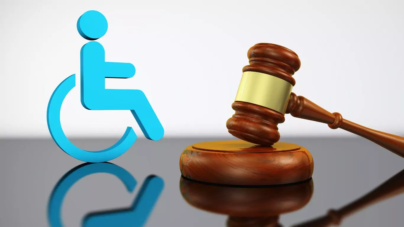 An image of court hammer with the icon for people with disabilities