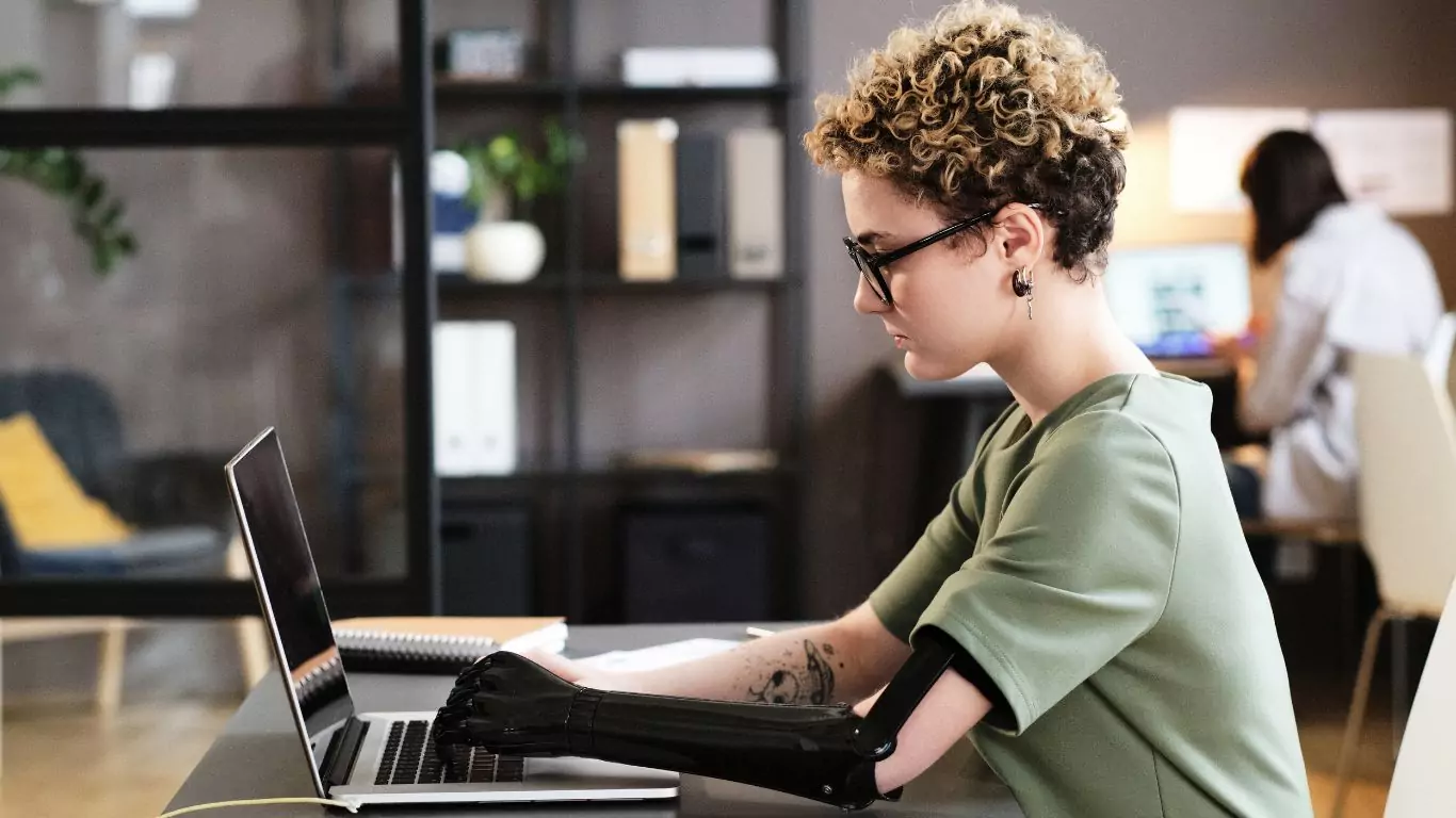 A young woman with prosthetic arm