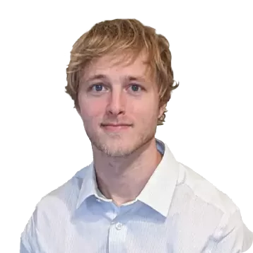 White male with short blonde hair. Smiling, he is wearing a white collared shirt.