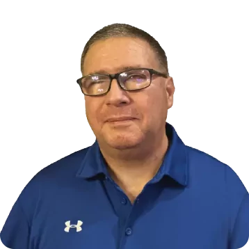 White male with short dark hair. Smiling, he is wearing glasses and a blue collared shirt.