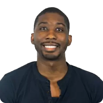 Black male with short dark hair and a beard. Smiling, he is wearing a dark blue shirt.