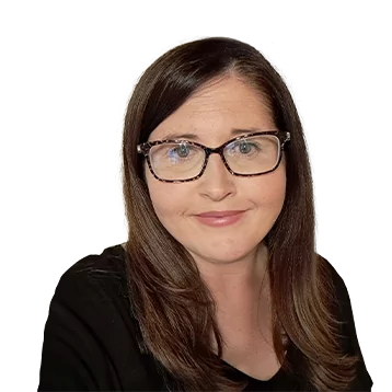 White female with long brown hair. Smiling, she is wearing a black shirt and glasses.